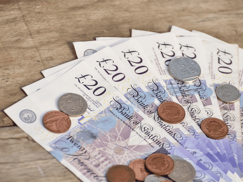 Person comparing solicitor quotes and considering value over low-cost legal services